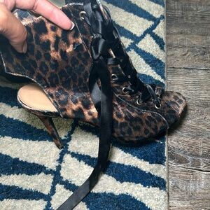 Anne Mitchell’s cheetah print heels